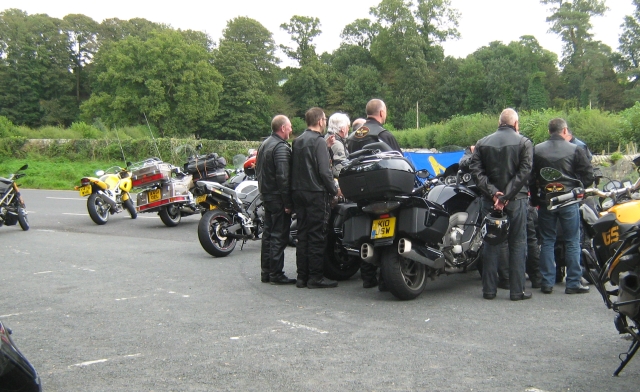 a handful of bikers among their bikes at devils bridge, kirkby lonsdale